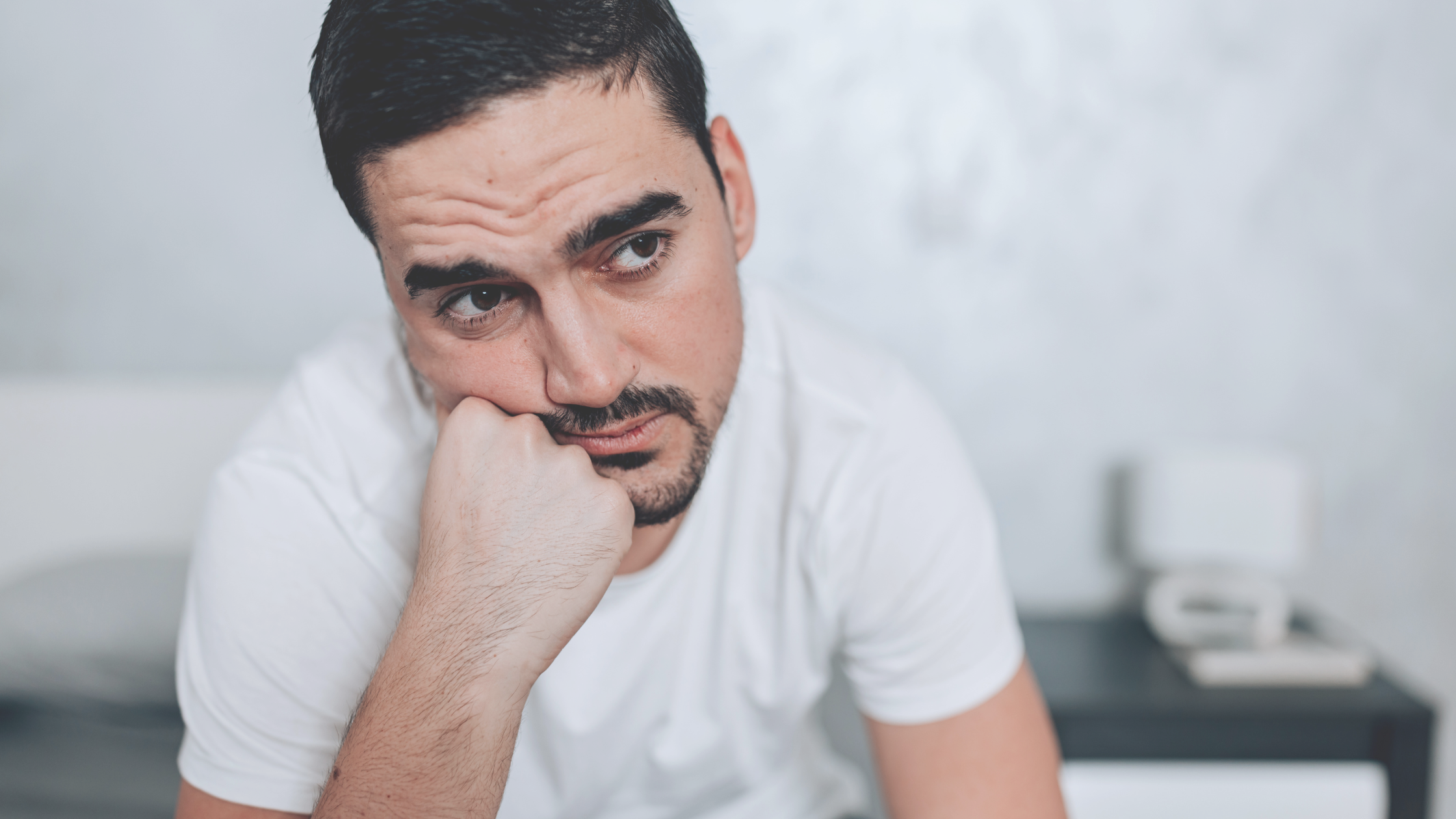 29 a man with his hand on his chin social anxiety